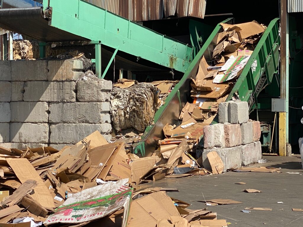 green baler bailing cardboard